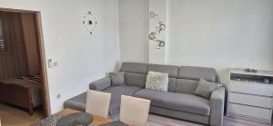 a living room with a couch and a table at Apartman J&B in Vir
