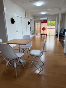 a dining room with a table and chairs at MIYARA GARDEN House in Ishigaki Island +19 photos
