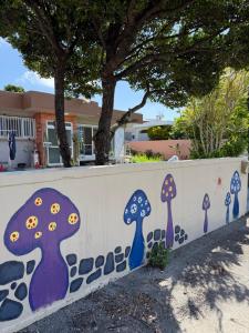 a wall with painted mushrooms on it at MIYARA GARDEN House in Ishigaki Island