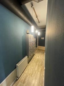 a hallway of a room with a hard wood floor at Hostel Room 110 in Tbilisi City