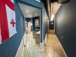 a bathroom with a flag on the wall at Hostel Room 110 in Tbilisi City