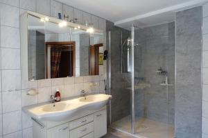 a bathroom with a sink and a shower at Ferienwohnung Fam. Höhn in Kappel-Grafenhausen +22 photos