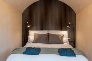 a bedroom with a bed with two bags on it at Riverberg puhkemaja Otepääl in Otepää