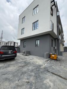 a car parked in front of a building at Pristine Residences Premium 2 Bedroom Apartment Ajah Lagos in Lekki