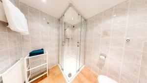 a bathroom with a shower and a walk in shower at Wohnhaus Christoph in Längenfeld
