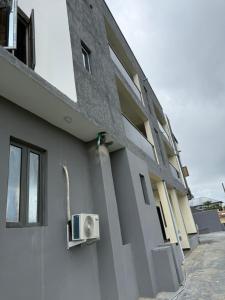a building with a air conditioner on the side of it at Pristine Residences Premium 2 Bedroom Apartment Ajah Lagos in Lekki +4 photos
