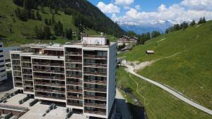 an apartment building in the middle of a mountain at A Quiet Place in Siviez