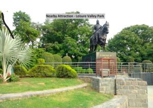 a statue of a man on a horse in a park at The Avenue Residency in Gurgaon