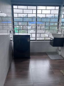 a bathroom with a sink and a window at BKR Homestay 1BH, 4th floor in Itānagar