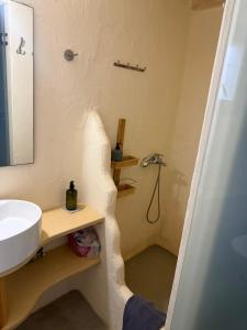 a bathroom with a sink and a shower at Casa Luca in Drios +6 photos