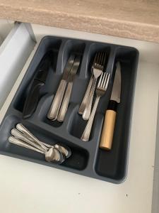 a black tray with utensils in a drawer at Your Home 27 with parking in Myslava