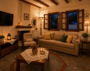 a living room with a couch and a table at Deja Blue in Mouresi +20 photos
