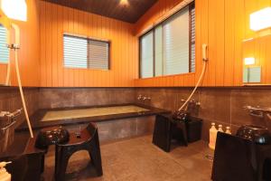 a large bathroom with a tub and a sink at Kii no Matsushima in Kihokucho +44 photos