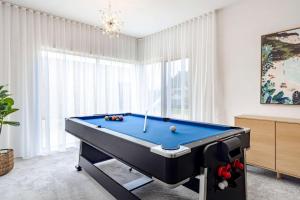 a room with a pool table in front of a window at Ultimate Ocean Views - Pet Friendly in Bellbrae