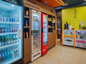 a store with a red refrigerator in a store at ibis budget Santos Gonzaga in Santos