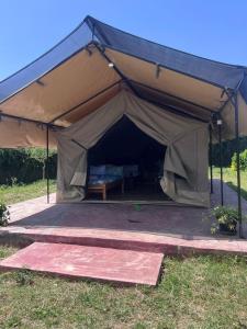a large tent with a bed in it at Oloiba Nkuti lodge in Sekenani