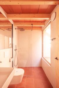 a bathroom with a toilet and a sink at La Rogeta in Tabarca
