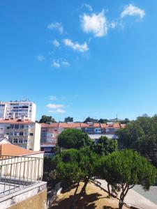 a view of a city with trees and buildings at Colombo Mall Room in Lisbon