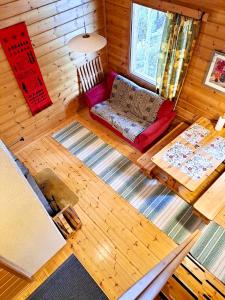 an overhead view of a living room in a log cabin at Holiday Home Marina in Tahkovuori