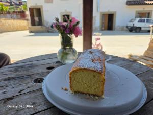 a piece of cake on a plate on a table at Bed&Wine Terrae Tiferni in Gioia Sannitica +19 photos