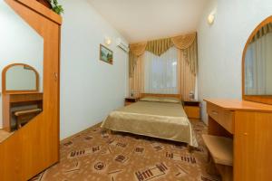 Llit o llits en una habitació de Guest house Kapitan S