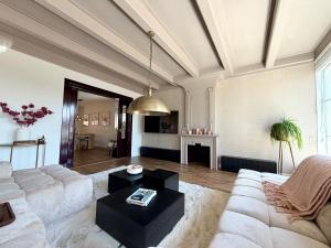 a living room with a couch and a table at Maison Bo Luxury Stay in Historic Lemmer in Lemmer