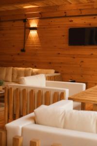 a living room with a couch and a table at Buneba Resort in Borçka