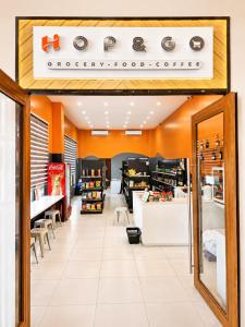 a store with orange walls and a sign on the wall at DG Coastal Comfort near Alona Beach - Pool, Gym and Play area in Dauis