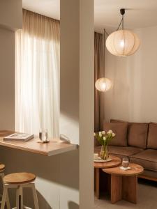 a living room with a couch and a table at Deos- Luxury Apartment in Agrinio in Agrinio