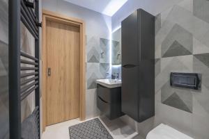 a bathroom with a toilet and a sink at West Athens Luxurius Apartment in Athens +27 photos