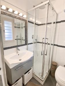 a bathroom with a shower and a sink and a toilet at Bright and silent studio in Bardonecchia centre in Bardonecchia