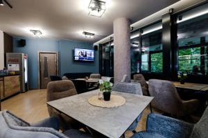 a meeting room with a table and chairs at Philippopolis Hotel in Plovdiv