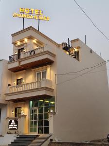 a building with a sign on top of it at Hotel Chunda Niwas in Dabok