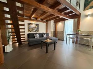 a living room with a couch and a table at CasaCastellett in Modica