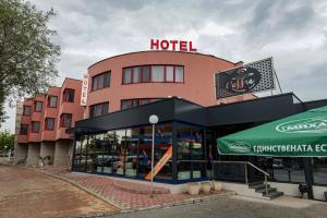 a hotel with a sign on top of it at Philippopolis Hotel in Plovdiv