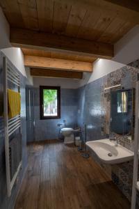 a bathroom with a sink and a toilet and a window at Il Moro in Tolentino +22 photos