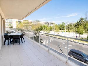a balcony with a table and a view of a street at Ventura Park CC3 in Salou