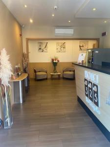 a waiting room at a hotel with a counter at Hotel 325 Tor Vergata in Tor Vergata