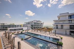 a swimming pool on the roof of a building at BIRGÉS HOTEL Lifestyle and View in Balatonfüred