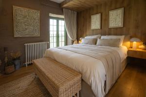 a bedroom with a large bed and a window at BaguHouse in Pombal +20 photos