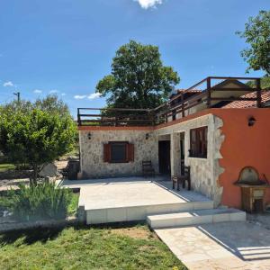 a house with a patio in front of it at Villa Mramor in Neum
