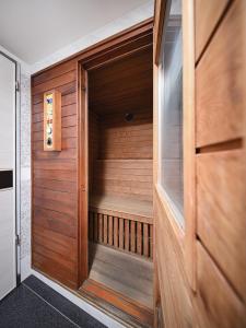 a sauna in a house with a wooden door at Guide Hotel Taoyuan Fuxing in Taoyuan +63 photos