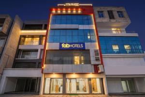 a building with a sign on the side of it at FabHotel Samarth Residency By the Arrow in New Delhi