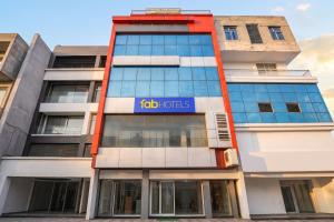 a tall building with a job roles sign on it at FabHotel Samarth Residency By the Arrow in New Delhi