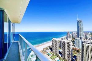 a view of the beach from the balcony of a building at Luxurious 2 Bedroom Apartment - Ocean View in Gold Coast
