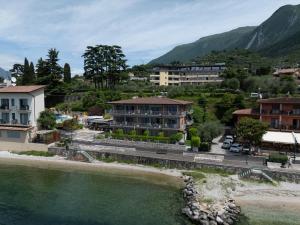 an aerial view of a town next to a river at Ambienthotel Spiaggia in Malcesine