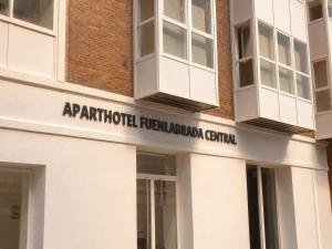 a sign on the side of a building at Aparthotel Fuenlabrada Central in Fuenlabrada