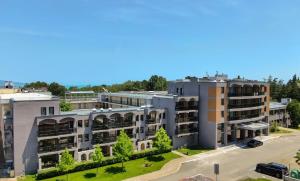an aerial view of an apartment complex at Hotel Longosa - All Inclusive Family Hotel near the beach in the peaceful southern part of Sunny Beach in Sunny Beach