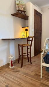 a dining room with a table and a chair at Piano Piano Affittacamere in Andagna +8 photos