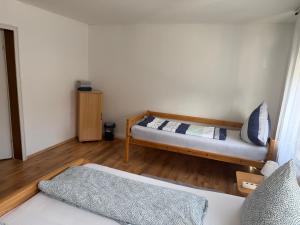 a bedroom with a bed and a couch in it at Zentral in Siegen